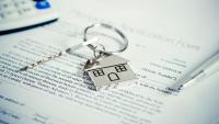 A housing application with keys and pen